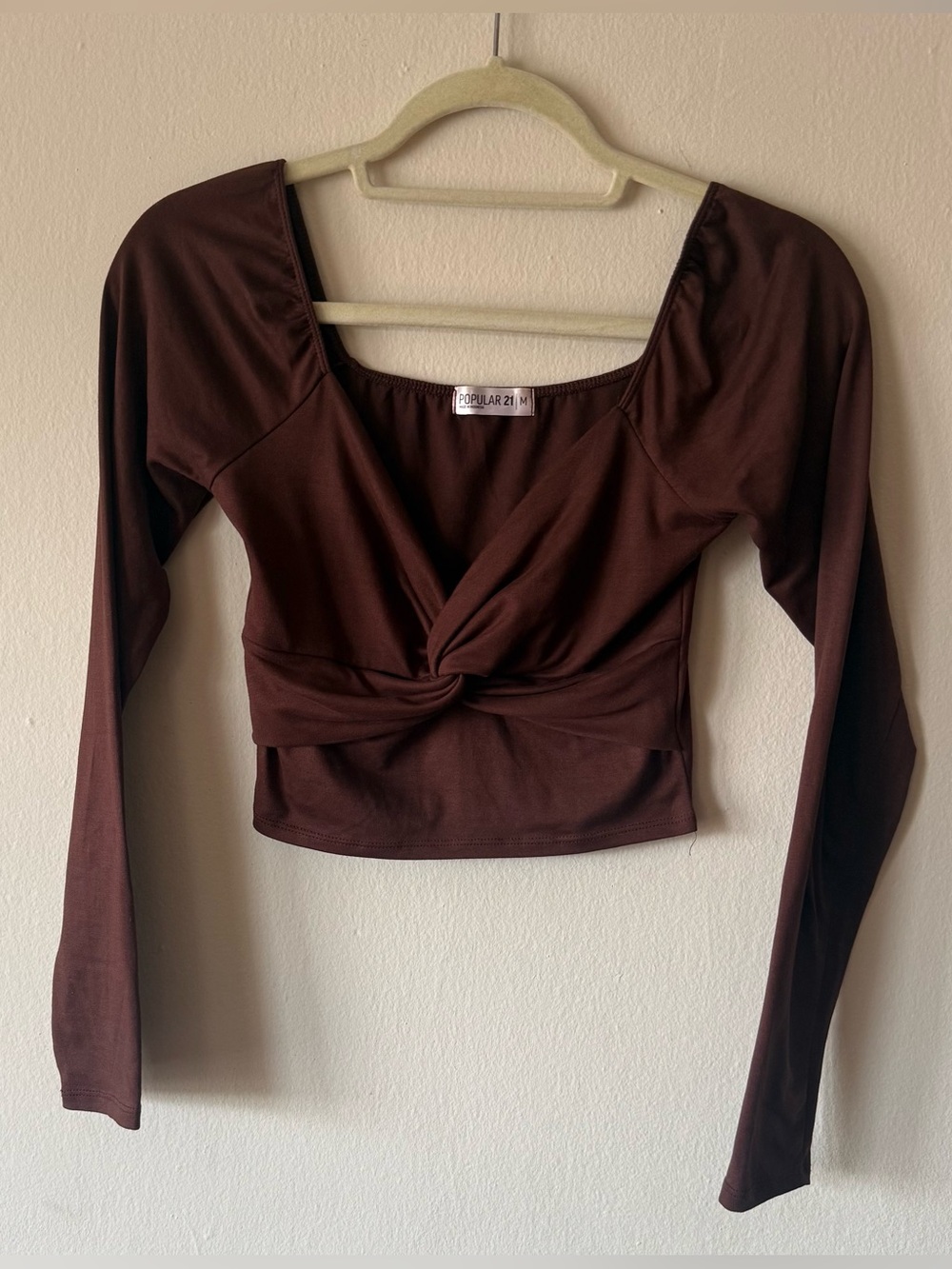 Brown long sleeve crop top with twisty neckline
